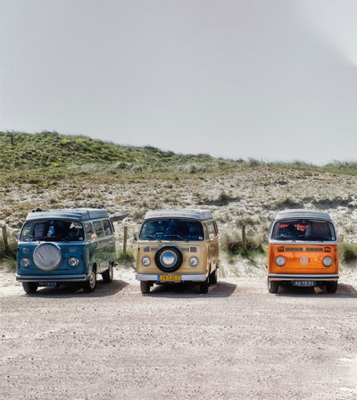 Three vans parked side by side