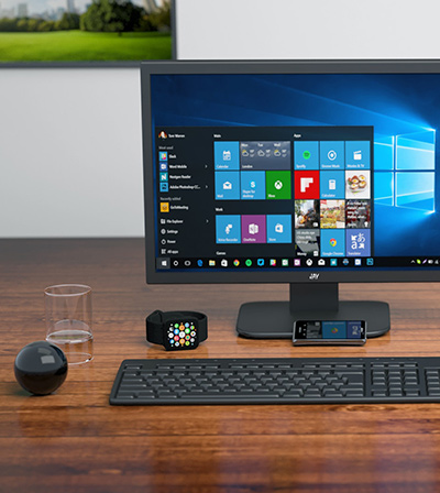 Desktop computer and smart watch on a desk